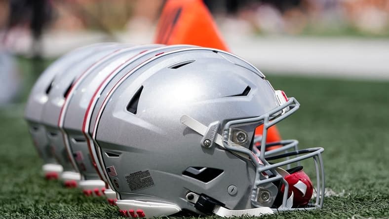 Sep 2, 2023; Bloomington, Indiana, USA; Ohio State Buckeyes helmets sit on the sideline prior to the NCAA football game at Indiana University Memorial Stadium. Ohio State won 23-3.
