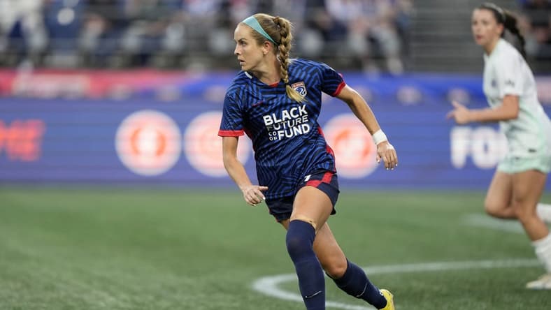 Sep 6, 2023; Seattle, WA, USA; OL Reign midfielder Nikki Stanton (7) kicks the ball against Racing Louisville FC during the first half at Lumen Field. Mandatory Credit: Stephen Brashear-USA TODAY Sports