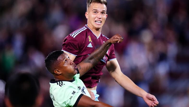 Sep 30, 2023; Commerce City, Colorado, USA; Austin FC midfielder Jhojan Valencia (5) and Colorado Rapids midfielder Cole Bassett (23) during the second half at Dick's Sporting Goods Park. Mandatory Credit: Ron Chenoy-USA TODAY Sports