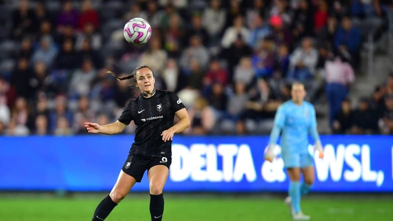 Oct 2, 2023; Los Angeles, California, USA; Angel City FC defender Megan Reid (6) passes the ball during the second half against the Orlando Pride at BMO Stadium. Mandatory Credit: Gary A. Vasquez-USA TODAY Sports