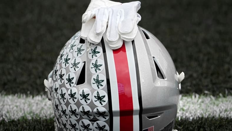 Oct. 14, 2023; Lafayette, In., USA;
Gloves lie on top of the helmet of Ohio State Buckeyes wide receiver Julian Fleming (4) before Saturday's NCAA Division I football game against the Purdue Boilermakers at Ross-Ade Stadium in Lafayette.