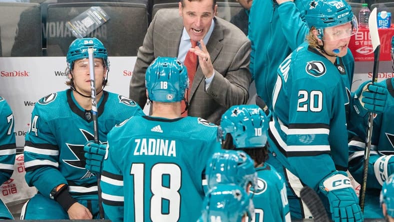 Oct 17, 2023; San Jose, California, USA; San Jose Sharks head coach David Quinn instructs San Jose Sharks right wing Filip Zadina (18) during a stoppage of play against the Carolina Hurricanes during the third period at SAP Center at San Jose. Mandatory Credit: Robert Edwards-USA TODAY Sports