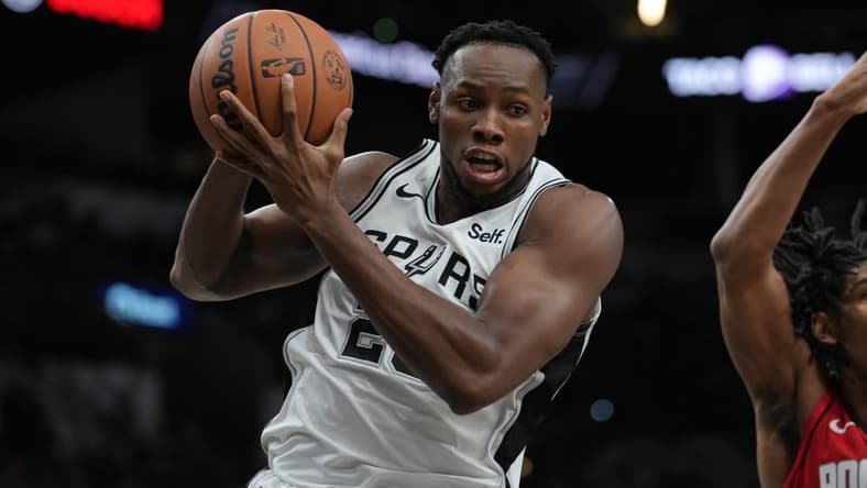 Oct 18, 2023; San Antonio, Texas, USA; San Antonio Spurs center Charles Bassey (28) rebounds in the second half against the Houston Rockets at the Frost Bank Center. Mandatory Credit: Daniel Dunn-USA TODAY Sports