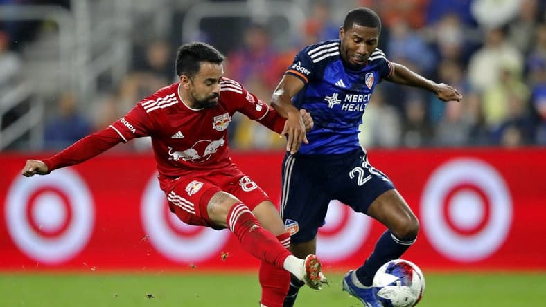 Oct 29, 2023; Cincinnati, OH, USA; New York Red Bulls midfielder Luquinhas (82) battles for the ball against FC Cincinnati defender Ray Gaddis (28) during the first half of game one in a round one match of the 2023 MLS Cup Playoffs at TQL Stadium. Mandatory Credit: Katie Stratman-USA TODAY Sports