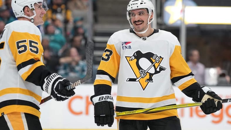 Nov 4, 2023; San Jose, California, USA; Pittsburgh Penguins left wing Matt Nieto (83) talks with center Noel Acciari (55) during the second period against the San Jose Sharks at SAP Center at San Jose. Mandatory Credit: Darren Yamashita-USA TODAY Sports