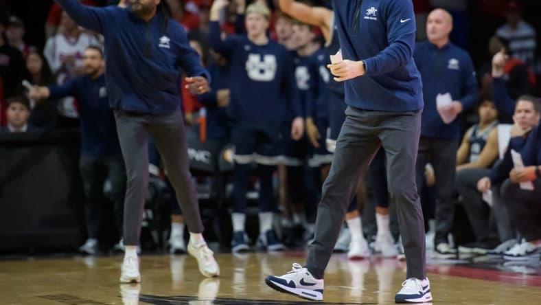 Utah State head coach Danny Sprinkle, right, and his assistants shout instructions to the Aggies in the final seconds of the second half of the Bradley Braves' home opener Saturday, Nov. 11, 2023 at Carver Arena.