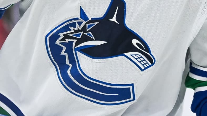 Nov 12, 2023; Montreal, Quebec, CAN; View of a Vancouver Canucks logo on a jersey worn by a member of the team against the Montreal Canadiens during the second period at Bell Centre. Mandatory Credit: David Kirouac-USA TODAY Sports
