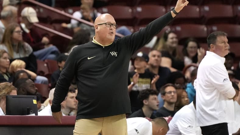 Nov 19, 2023; Charleston, SC, USA; Wake Forest Demon Deacons head coach Steve Forbes sends a play in the first half against the LSU Tigers at TD Arena. Mandatory Credit: David Yeazell-USA TODAY Sports