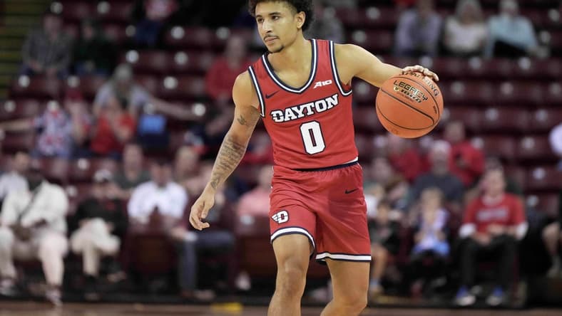 Nov 19, 2023; Charleston, SC, USA; Dayton Flyers guard Javon Bennett (0) brings the ball up court in the second half against the Houston Cougars at TD Arena. Mandatory Credit: David Yeazell-USA TODAY Sports