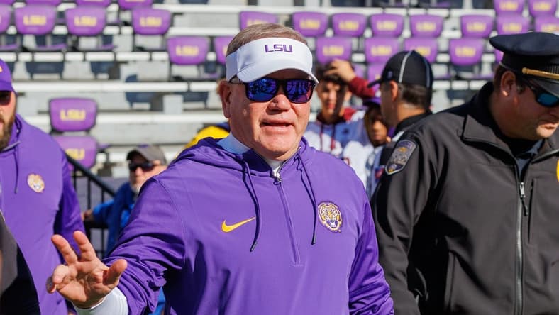 Nov 25, 2023; Baton Rouge, Louisiana, USA; LSU Tigers head coach Brian Kelly waves to fans during warmups before the game against the Texas A&M Aggies at Tiger Stadium. Mandatory Credit: Stephen Lew-USA TODAY Sports