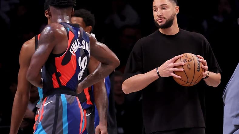 Nov 30, 2023; Brooklyn, New York, USA; Brooklyn Nets injured guard Ben Simmons (10) holds a basketball on the court during a time out during the third quarter against the Charlotte Hornets at Barclays Center. Mandatory Credit: Brad Penner-USA TODAY Sports