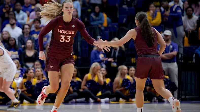 Nov 30, 2023; Baton Rouge, Louisiana, USA; Virginia Tech Hokies center Elizabeth Kitley (33) slaps hands with Virginia Tech Hokies guard Georgia Amoore (5) against the LSU Lady Tigers during the second half at Pete Maravich Assembly Center. Mandatory Credit: Matthew Hinton-USA TODAY Sports
