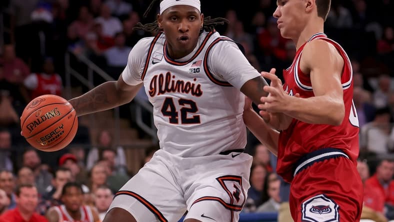 Dec 5, 2023; New York, New York, USA; Illinois Fighting Illini forward Dain Dainja (42) controls the ball against Florida Atlantic Owls center Vladislav Goldin (50) during the first half at Madison Square Garden. Mandatory Credit: Brad Penner-USA TODAY Sports
