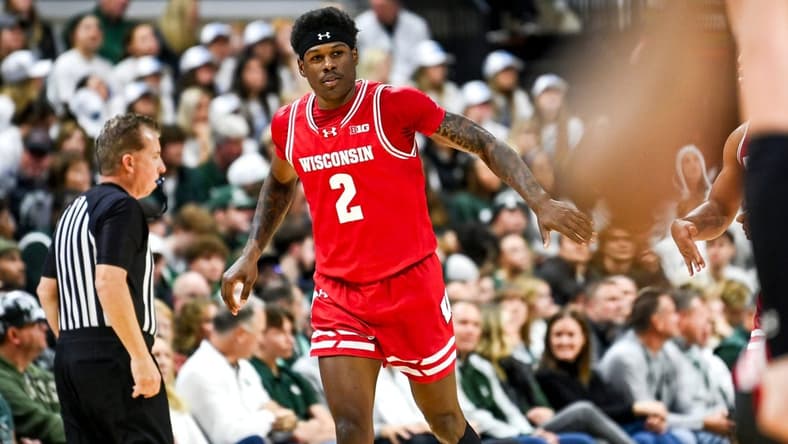 Wisconsin's AJ Storr celebrates after making a 3-pointer against Michigan State to end the first half on Tuesday, Dec. 5, 2023, at the Breslin Center in East Lansing.