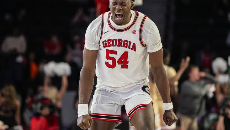 Dec 5, 2023; Athens, Georgia, USA; Georgia Bulldogs center Russel Tchewa (54) reacts after a Georgia basket against the Georgia Tech Yellow Jackets during the second half at Stegeman Coliseum. Mandatory Credit: Dale Zanine-USA TODAY Sports