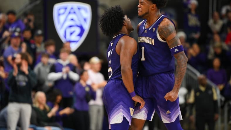 Dec 9, 2023; Seattle, Washington, USA; Washington Huskies guard Sahvir Wheeler (5) and forward Keion Brooks Jr. (1) celebrate after a scored against the Gonzaga Bulldogs during the second half at Alaska Airlines Arena at Hec Edmundson Pavilion. Mandatory Credit: Steven Bisig-USA TODAY Sports