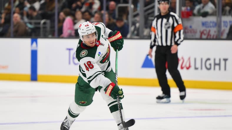 Dec 10, 2023; Seattle, Washington, USA; Minnesota Wild defenseman Jared Spurgeon (46) shoots the puck against the Seattle Kraken during the third period at Climate Pledge Arena. Mandatory Credit: Steven Bisig-USA TODAY Sports