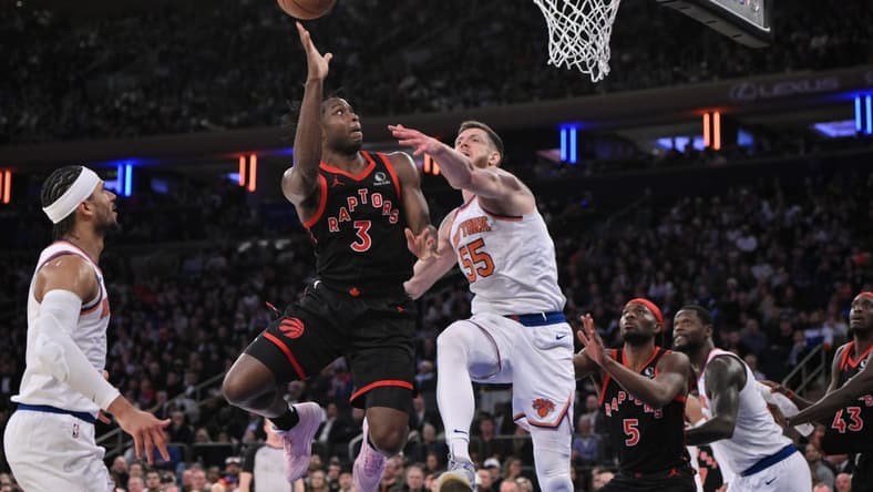 Dec 11, 2023; New York, New York, USA; Toronto Raptors forward O.G. Anunoby (3) shoots the ball while being defended by New York Knicks center Isaiah Hartenstein (55) during the fourth quarter at Madison Square Garden. Mandatory Credit: John Jones-USA TODAY Sports