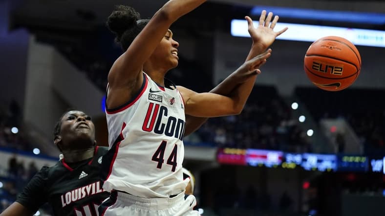 Dec 16, 2023; Hartford, Connecticut, USA; UConn Huskies guard Aubrey Griffin (44) is fouled by Louisville Cardinals forward Olivia Cochran (44) in the second half at XL Center. Mandatory Credit: David Butler II-USA TODAY Sports