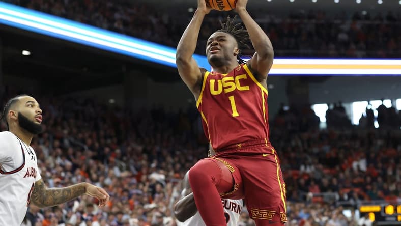 Dec 17, 2023; Auburn, Alabama, USA; USC Trojans guard Isaiah Collier (1) shoots a layup against the Auburn Tigers during the first half at Neville Arena. Mandatory Credit: John Reed-USA TODAY Sports
