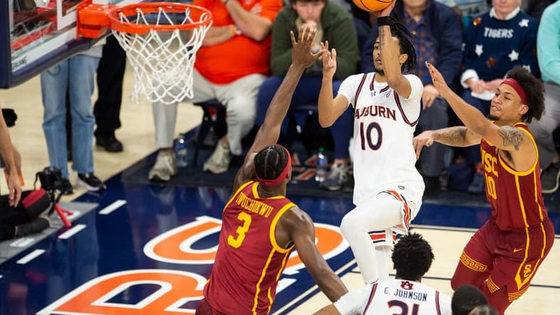 Auburn Tigers player Chad Baker-Mazara (10) shoots a floater as Auburn Tigers take on USC Trojans at Neville Arena in Auburn, Ala., on Sunday, Dec. 17, 2023. Auburn Tigers defeated USC Trojans 91-75.