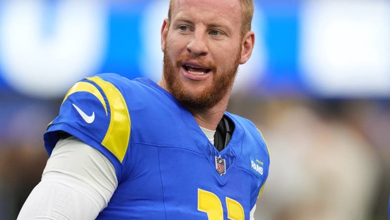 Dec 17, 2023; Inglewood, California, USA; Los Angeles Rams quarterback Carson Wentz (11) reacts during the first half against the Washington Commanders at SoFi Stadium. Mandatory Credit: Kirby Lee-USA TODAY Sports