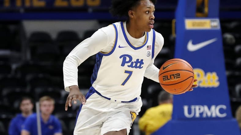 Dec 20, 2023; Pittsburgh, Pennsylvania, USA; Pittsburgh Panthers guard Carlton Carrington (7) dribbles up court on a fast break against the IPFW Mastodons during the first half at the Petersen Events Center. Mandatory Credit: Charles LeClaire-USA TODAY Sports