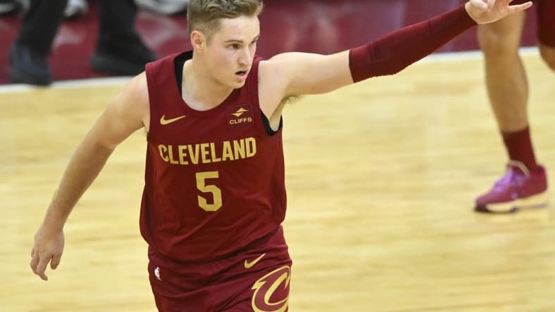 Dec 20, 2023; Cleveland, Ohio, USA; Cleveland Cavaliers guard Sam Merrill (5) celebrates his three-point basket in the fourth quarter against the Utah Jazz at Rocket Mortgage FieldHouse. Mandatory Credit: David Richard-USA TODAY Sports