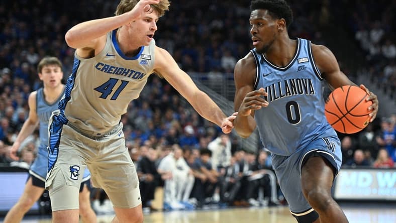 Dec 20, 2023; Omaha, Nebraska, USA; Villanova Wildcats guard TJ Bamba (0) drives against Creighton Bluejays forward Isaac Traudt (41) in the first half at CHI Health Center Omaha. Mandatory Credit: Steven Branscombe-USA TODAY Sports