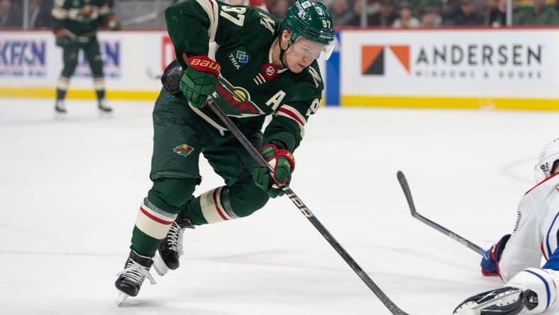Dec 21, 2023; Saint Paul, Minnesota, USA; Minnesota Wild left wing Kirill Kaprizov (97) skates around a Montreal Canadiens player in the first period at Xcel Energy Center. Mandatory Credit: Matt Blewett-USA TODAY Sports