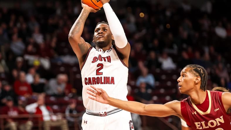 Dec 22, 2023; Columbia, South Carolina, USA; South Carolina Gamecocks forward B.J. Mack (2) shoots over Elon Phoenix guard LA Pratt (22) in the first half at Colonial Life Arena. Mandatory Credit: Jeff Blake-USA TODAY Sports