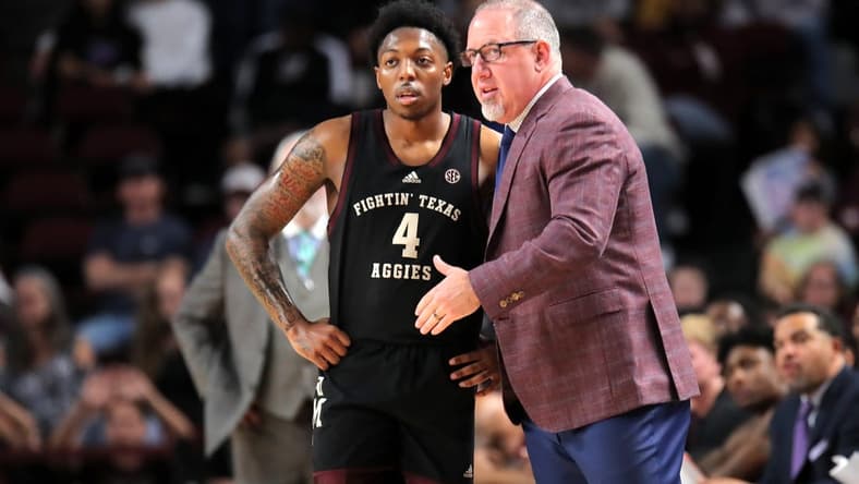Dec 22, 2023; College Station, Texas, USA; Texas A&M Aggies head coach Buzz Williams (right) talks with Texas A&M Aggies guard Wade Taylor IV (4) against the Houston Christian Huskies during the first half at Reed Arena. Mandatory Credit: Erik Williams-USA TODAY Sports