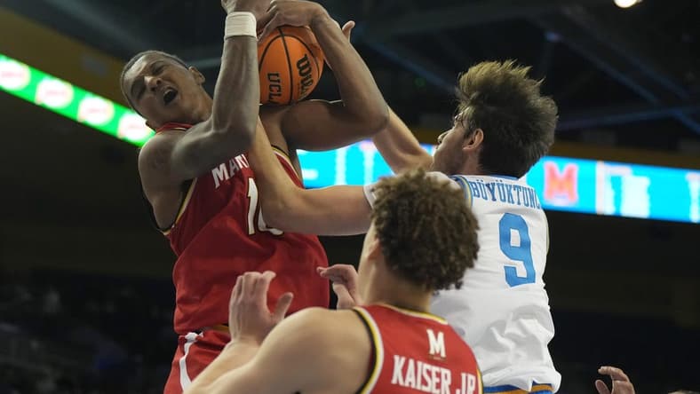 Dec 22, 2023; Los Angeles, California, USA; Maryland Terrapins forward Julian Reese (10) and UCLA Bruins forward Berke Buyuktuncel (9) battle for the ball in the second half at Pauley Pavilion presented by Wescom. Mandatory Credit: Kirby Lee-USA TODAY Sports