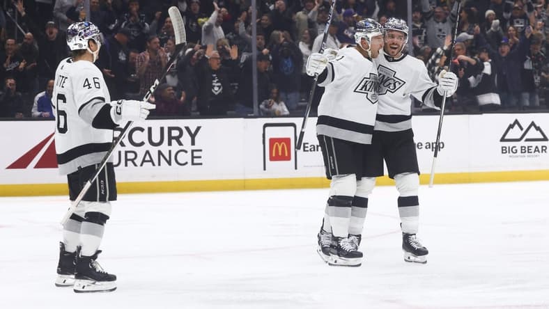 Dec 27, 2023; Los Angeles, California, USA; Los Angeles Kings center Trevor Lewis (61) celebrates with his teammates after scoring a goal during the second period of a game against the San Jose Sharks at Crypto.com Arena. Mandatory Credit: Jessica Alcheh-USA TODAY Sports