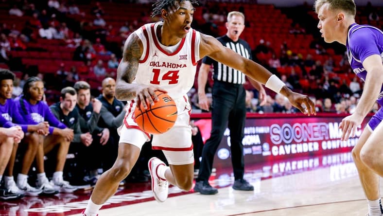 Oklahoma forward Jalon Moore (14) works toward the hoop in the first half during an NCAA game between the Oklahoma Sooners and the Central Arknasaw Bears at the Lloyd Noble Center in Norman, Okla., on Thursday, Dec. 28, 2023.