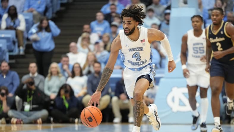 Dec 29, 2023; Chapel Hill, North Carolina, USA; North Carolina Tar Heels guard RJ Davis (4) on the fast break in the second half at Dean E. Smith Center. Mandatory Credit: Bob Donnan-USA TODAY Sports