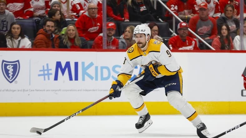 Dec 29, 2023; Detroit, Michigan, USA; Nashville Predators left wing Filip Forsberg (9) handles the puck during the third period of the game between the Detroit Red Wings and the Nashville Predators at Little Caesars Arena. Mandatory Credit: Brian Bradshaw Sevald-USA TODAY Sports