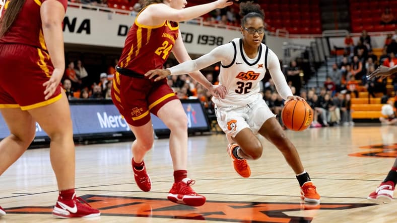 Dec 30, 2023; Stillwater, Okla, USA ; Oklahoma State Cowgirls guard Stailee Heard (32) drives past Iowa State Cyclones forward Addy Brown (24) in the first half of an NCAA women s basketball game at Gallagher Iba arena. Mandatory Credit: Mitch Alcala-The Oklahoman