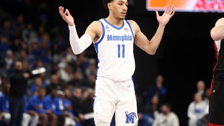 Dec 30, 2023; Memphis, Tennessee, USA; Memphis Tigers guard Jahvon Quinerly (11) reacts during the second half against the Austin Peay Governors at FedExForum. Mandatory Credit: Petre Thomas-USA TODAY Sports
