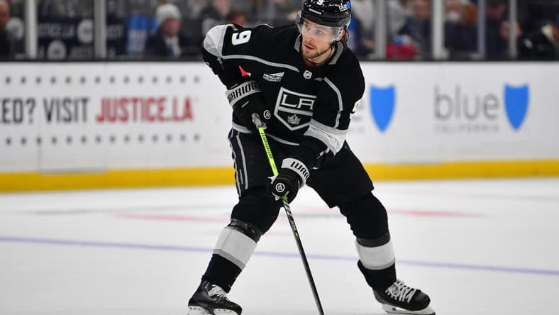 Dec 30, 2023; Los Angeles, California, USA; Los Angeles Kings right wing Adrian Kempe (9) controls the puck against the Edmonton Oilers during the overtime period at Crypto.com Arena. Mandatory Credit: Gary A. Vasquez-USA TODAY Sports