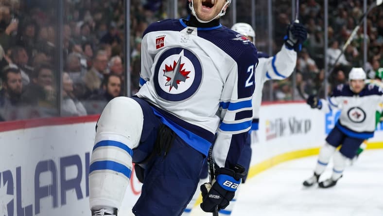 Dec 31, 2023; Saint Paul, Minnesota, USA; Winnipeg Jets center Dominic Toninato (21) celebrates his goal against the Minnesota Wild during the third period at Xcel Energy Center. Mandatory Credit: Matt Krohn-USA TODAY Sports