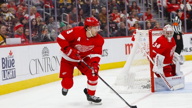 Dec 31, 2023; Detroit, Michigan, USA; Detroit Red Wings defenseman Ben Chiarot (8) handles the puck during the third period of the game against the Boston Bruins at Little Caesars Arena. Mandatory Credit: Brian Bradshaw Sevald-USA TODAY Sports