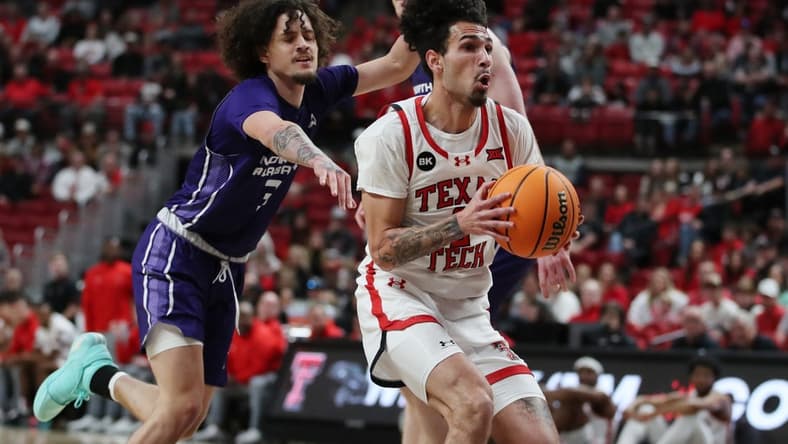 Jan 1, 2024; Lubbock, Texas, USA; Texas Tech Red Raiders guard Pop Isaacs (2) stops to take a shot against North Alabama Lions guard KJ Johnson (3) in the first half at United Supermarkets Arena. Mandatory Credit: Michael C. Johnson-USA TODAY Sports
