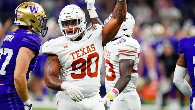 Jan 1, 2024; New Orleans, LA, USA; Texas Longhorns defensive lineman Byron Murphy II (90) celebrates after a play during the second quarter in the 2024 Sugar Bowl college football playoff semifinal game at Caesars Superdome. Mandatory Credit: John David Mercer-USA TODAY Sports