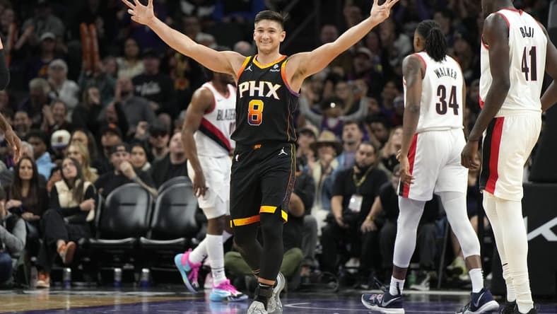 Jan 1, 2024; Phoenix, Arizona, USA; Phoenix Suns guard Grayson Allen (8) reacts after guard Devin Booker (1) makes a basket against the Portland Trail Blazers in the second half at Footprint Center. Mandatory Credit: Rick Scuteri-USA TODAY Sports