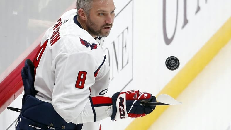 Jan 2, 2024; Pittsburgh, Pennsylvania, USA; Washington Capitals left wing Alex Ovechkin (8) juggles the puck to warm up before the game against the Pittsburgh Penguins at PPG Paints Arena. Mandatory Credit: Charles LeClaire-USA TODAY Sports