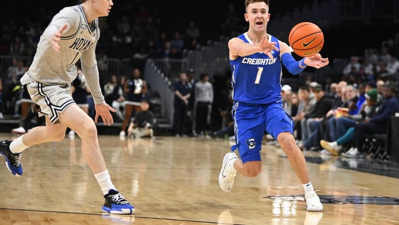Jan 2, 2024; Washington, District of Columbia, USA; Creighton Bluejays guard Steven Ashworth (1) passes the ball as Georgetown Hoyas guard Rowan Brumbaugh (1) looks on during the first half at Capital One Arena. Mandatory Credit: Brad Mills-USA TODAY Sports