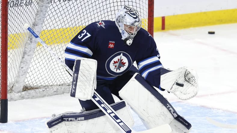 Jan 2, 2024; Winnipeg, Manitoba, CAN; Winnipeg Jets goaltender Connor Hellebuyck (37) warms up before a game against the Tampa Bay Lightning at Canada Life Centre. Mandatory Credit: James Carey Lauder-USA TODAY Sports