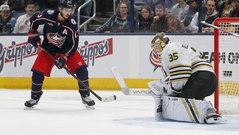 Jan 2, 2024; Columbus, Ohio, USA; Boston Bruins goalie Linus Ullmark (35) makes a save as Columbus Blue Jackets left wing Johnny Gaudreau (13) looks for a rebound during the first period at Nationwide Arena. Mandatory Credit: Russell LaBounty-USA TODAY Sports