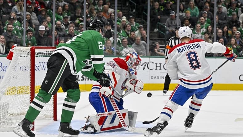 Jan 2, 2024; Dallas, Texas, USA; Dallas Stars center Roope Hintz (24) attempts to put the puck past Montreal Canadiens goaltender Sam Montembeault (35) and defenseman Mike Matheson (8) during the second period at the American Airlines Center. Mandatory Credit: Jerome Miron-USA TODAY Sports